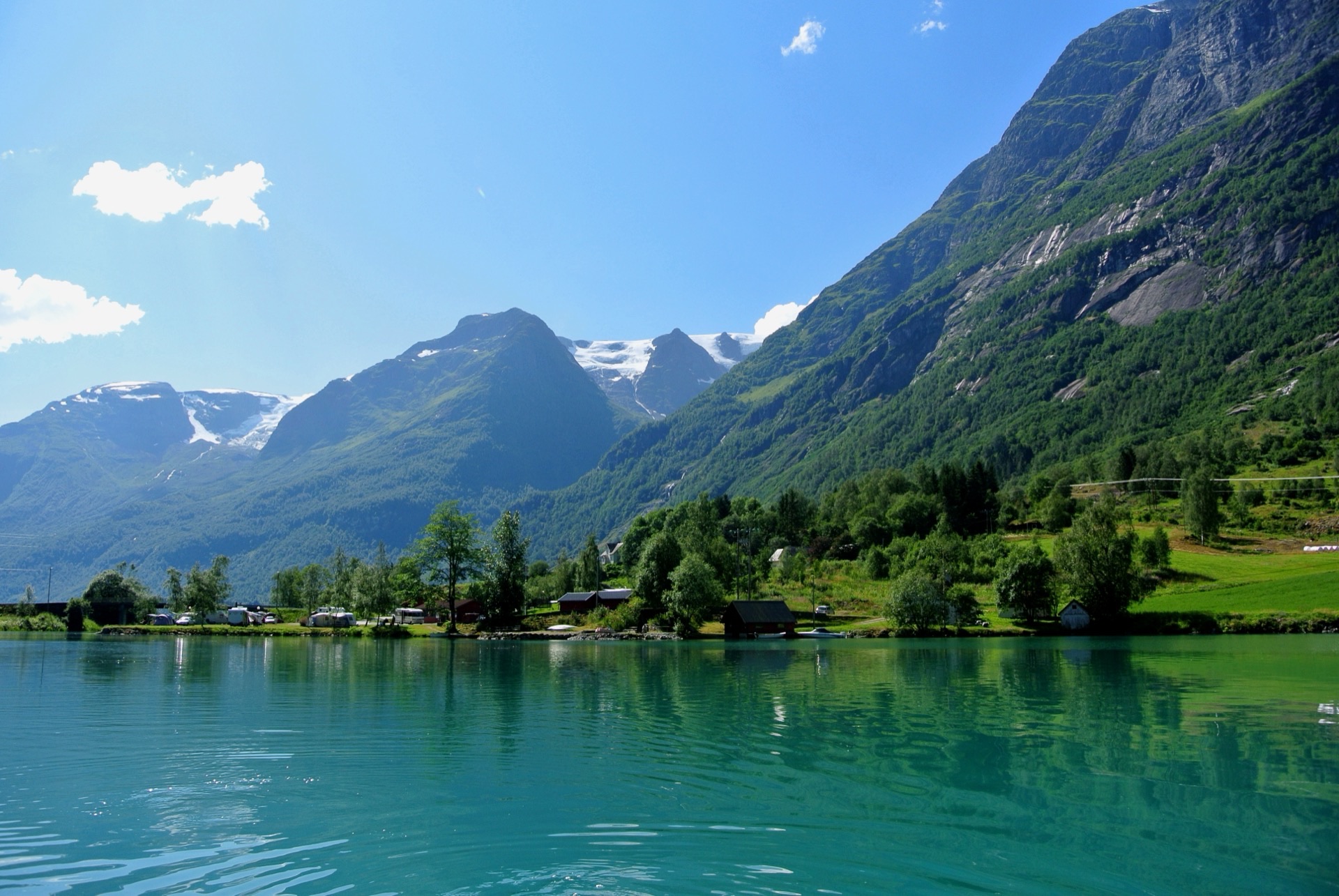 Olden harbour and waterfront with Nordfjord mountains, Olden cruise port, Norway